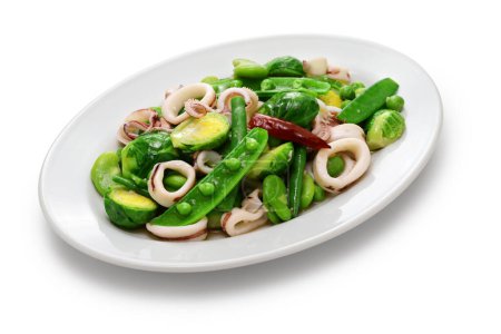Photo for Spring salad with peas, beans, brussels sprouts, and calamari. - Royalty Free Image