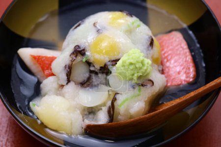 Kaburamushi, Japanese cuisine. Grated Shogoin turnip mixed with whipped egg white is wrapped around ingredients (ginkgo nuts, lily bulbs, wood ears, fish meat), steamed, and then topped with a clear soup made with arrowroot powder. 