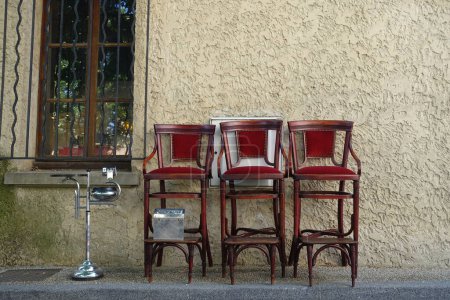 Photo for Shoe shine chairs outside an antique shop in France - Royalty Free Image