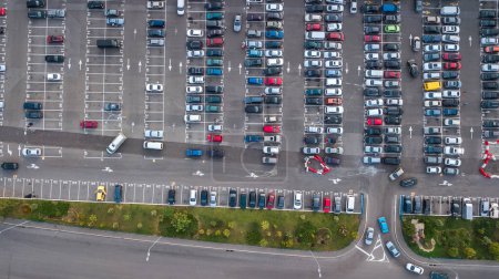 Parking lot with many cars aerial top drone view from above, city transportation and urban concept