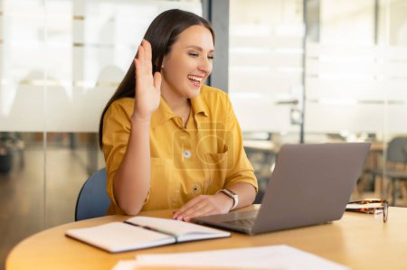 Photo for Happy young nice woman looking at laptop screen, holding video call meeting conversation, discussing working issues, passing job interview from home, distant communication concept - Royalty Free Image