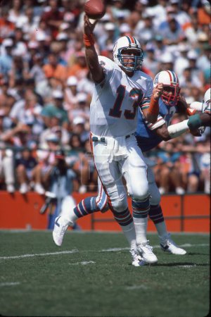 Photo for Miami Dolphins QB Dan Marino throwing a pass during an NFL Game in the 1990s. - Royalty Free Image