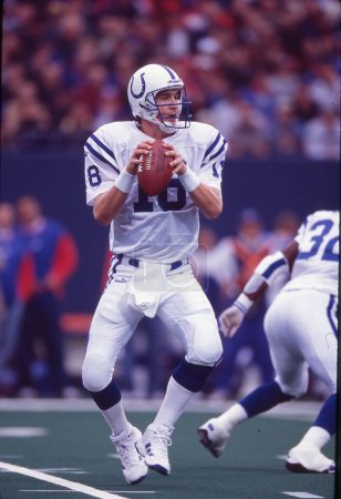 Photo for Indianapolis Colts QB Peyton Manning looking for an open receiver in an NFL game in the late 1990s. - Royalty Free Image