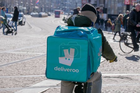 Photo for Deliveroo Delivery Rider At Amsterdam The Netherlands 6-3-2022 - Royalty Free Image