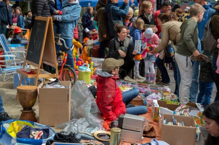 Photo for Kid Selling At The Fleamarket At Artis Zoo During Kingsday At Amsterdam The Netherlands 27-4-2019 - Royalty Free Image