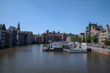 Photo for Old Historical Houses At The Canal Around Damrak Amsterdam The Netherlands 15-6-2022 - Royalty Free Image