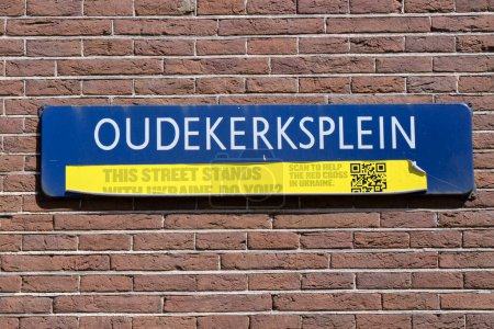 Photo for Street Sign Oudekerksplein With Ukraine Sticker At Amsterdam The Netherlands 11-6-2022 - Royalty Free Image