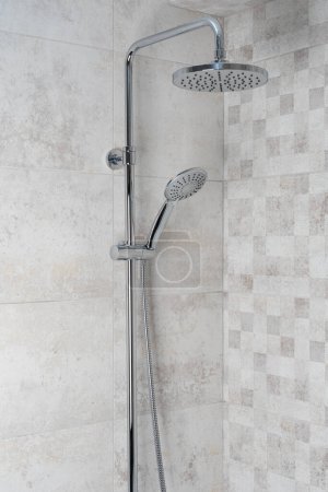 Photo for Water running from shower head in bathroom - Royalty Free Image