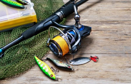 Photo for Fishing tackle on wooden background - Royalty Free Image