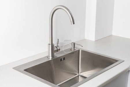 Photo for Modern kitchen faucet and sink - Royalty Free Image