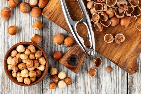 Photo for Raw hazelnut on the wooden table - Royalty Free Image