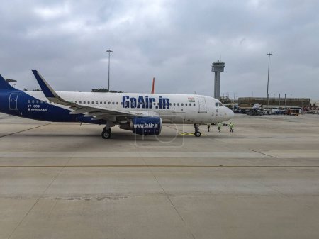 Photo for BIAL, Bengaluru, Bangalore, India - 27 December 2022 : Goair plane at the T1 terminal in Bangalore kempegowda airport, Asia - Royalty Free Image