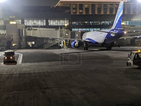 Photo for Bombay, Mumbai, India - 29 December 2022 : Indigo plane at T1 terminal in Mumbai airport - Royalty Free Image