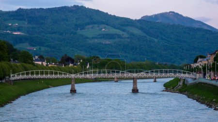 Photo for Austria, Salzburg, Europe, a bridge over a body of water with a mountain in the background - Royalty Free Image