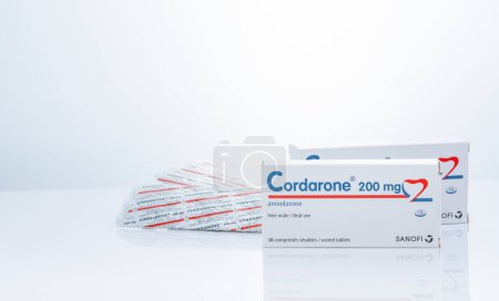 Photo for CHONBURI, THAILAND-SEPTEMBER 23, 2022 : Cordarone in blister pack and paper box packaging. Sanofi product. Amiodarone white tablet pills for treatment arrhythmias. Prescription drugs. Pharmaceutics. - Royalty Free Image