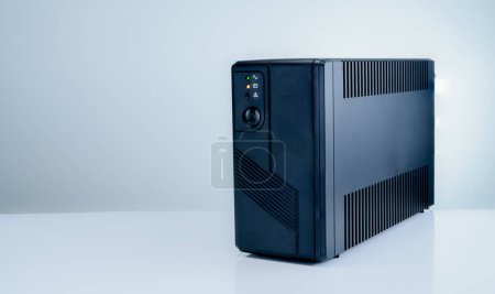 Photo for Uninterruptible power supply on white background. Backup Power UPS with battery. UPS with stabilizer for home PC. UPS inverter. Equipment for computer system at office for security. Power protection. - Royalty Free Image