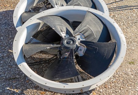 Photo for Axial metal air fan cooling propeller outside on the ground - Royalty Free Image