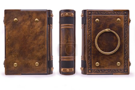 Aged leather book with the Ouroboros symbol on the front cover plate
