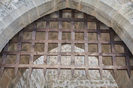 Photo for Cathedral entrance wooden defense gate. Lisbon, Portugal.  Portugal tour October 2023 - Royalty Free Image