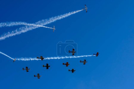 Photo for A World War 2 aircraft performs maneuvers during a Veterans Day airshow - Royalty Free Image