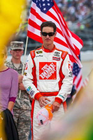Photo for DOVER, DE - MAY 15, 2011:  Joey Logano (20) stands by his car before the FedEx 400 at Dover International Speedway in Dover, DE. - Royalty Free Image