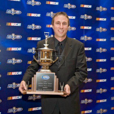 Photo for December 07, 2007 - Orlando, FL, USA: 2nd Place driver, David Reutimann, poses with his trophy at the Portofino Bay Hotel plays host to the NASCAR Busch Series Championship Banquet in Orlando, FL. - Royalty Free Image