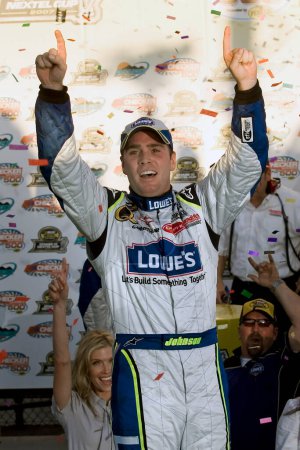 Photo for February 13, 2001 - Phoenix, AZ, USA: Jimmie Johnson takes the checkers at Phoenix International Raceway for the running of the NASCAR Nextel Cup Checker Auto Parts 500 race in Phoenix, AZ. - Royalty Free Image