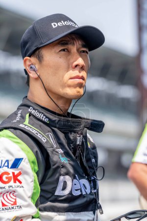 Photo for INDYCAR driver, Takuma Sato (11) of Tokyo, Japan, prepares to practice for the Indianapols 500 at the Indianapolis Motor Speedway in Indianapolis IN, USA. - Royalty Free Image