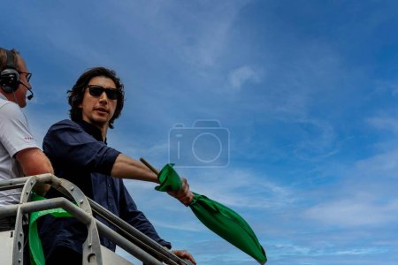 Photo for Honorary starter, Adam Driver, prepares to drop the green flag for the Indianapolis 500 in Indianapolis, IN, USA. - Royalty Free Image