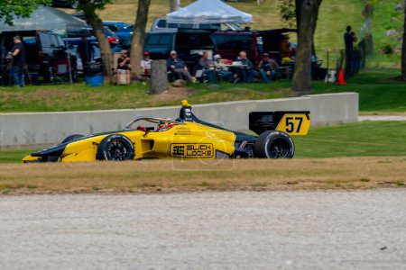 Photo for COLIN KAMINSKY (57) (R) of Joliet, Illinois travels through the turns during a practice for the Sonsio Grand Prix at Road America in Elkhart Lake WI. - Royalty Free Image