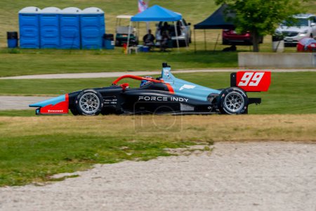Photo for ERNIE FRANCIS JR (99) of Davie, Florida travels through the turns during a practice for the Sonsio Grand Prix at Road America in Elkhart Lake WI. - Royalty Free Image