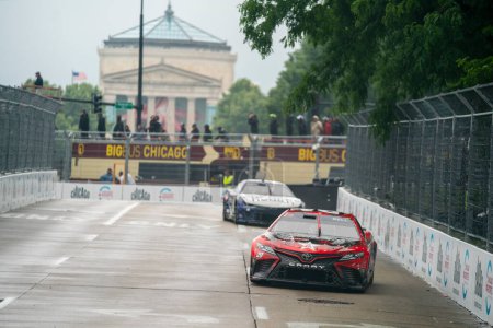 Photo for NASCAR Cup Driver, CHRISTOPHER BELL (20) races for position through the city streets for the Inaugural Grant Park 220 on the Chicago Street Course in Chicago IL. - Royalty Free Image