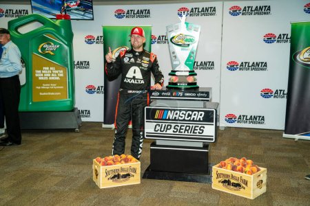 Photo for NASCAR Cup Driver, William Byron (24) celebrates his win for the Quaker State 400 Available at Walmart at the Atlanta Motor Speedway in Hampton GA. - Royalty Free Image