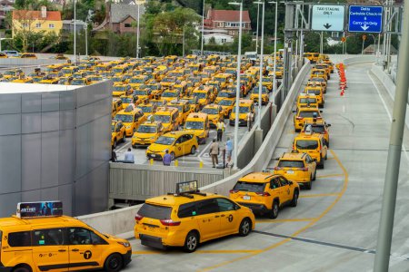 Photo for Yellow taxi cabs wait in line at LaGuardia Airport before picking up their fares. - Royalty Free Image