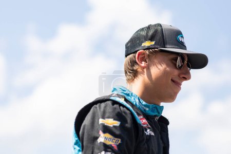 Photo for Carson Hocevar suits up on the grid prior to practice for the O'Reilly Auto Parts 150 at Mid-Ohio at Mid-Ohio Sports Car Course in Lexington OH. - Royalty Free Image