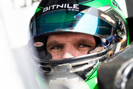 Photo for Conor Daly suits up on the grid prior to practice for the O'Reilly Auto Parts 150 at Mid-Ohio at Mid-Ohio Sports Car Course in Lexington OH. - Royalty Free Image