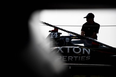Photo for The crew of AJ Foyt Racing  works on the car prior to a practice session for the Honda Indy 200 at Mid-Ohio at Mid-Ohio Sports Car Course in Lexington OH. - Royalty Free Image