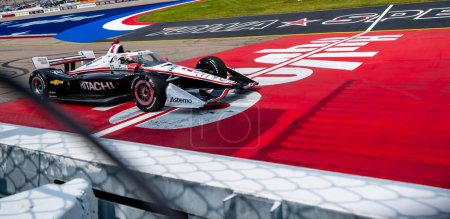 Photo for INDYCAR Driver, JOSEF NEWGARDEN (2) of Nashville, Tennessee, crosses the finish line at the end of the Hy-Vee INDYCAR Race Weekend race at the Iowa Speedway in Newton IA. - Royalty Free Image