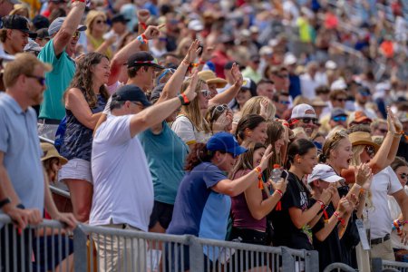 Photo for Fans watch all the race action during the Hy-Vee INDYCAR Race Weekend at the Iowa Speedway in Newton, IA, USA. - Royalty Free Image