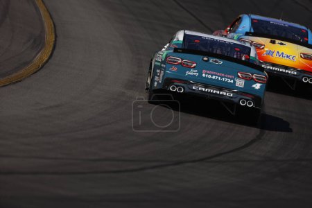 Photo for NASCAR Xfinity Series Driver, Garrett Smithley (4) races off turn three for the Pocono 225 at the Pocono Raceway in Long Pond PA. - Royalty Free Image