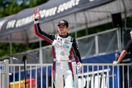 Photo for Chandler Smith  walks across the stage during driver intros prior to the Road America 180 at Road America in Elkhart Lake WI. - Royalty Free Image