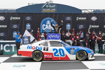 Photo for NASCAR Xfinity Series Driver, John Hunter Nemechek (20) celebrates his win for the CABO WABO 250 at the Michigan International Speedway in Brooklyn MI. - Royalty Free Image