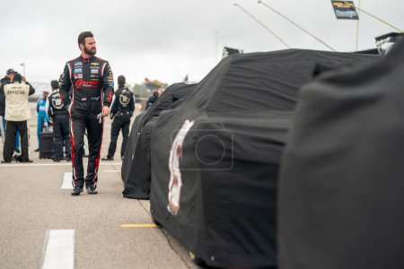 Photo for NASCAR Cup Series Driver, Corey LaJoie (7) takes to the track after a rain delay for the FireKeppers 400 at the Michigan International Speedway in Brooklyn MI. - Royalty Free Image