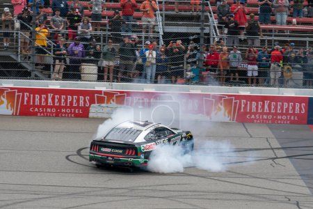 Photo for NASCAR Cup Series Driver, Chris Buescher (17) celebrates his win for the FireKeppers 400 at the Michigan International Speedway in Brooklyn MI. - Royalty Free Image