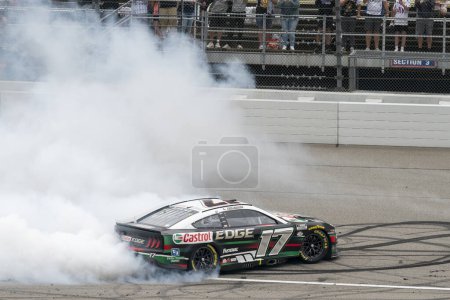 Photo for NASCAR Cup Series Driver, Chris Buescher (17) celebrates his win for the FireKeppers 400 at the Michigan International Speedway in Brooklyn MI. - Royalty Free Image