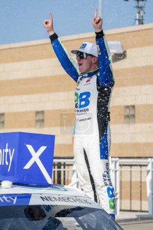 Photo for NASCAR Xfinity Series Driver John Hunter Nemechek (20) celebrates his win for the Kansas Lottery 300 at the Kansas Speedway in Kansas City KS. - Royalty Free Image