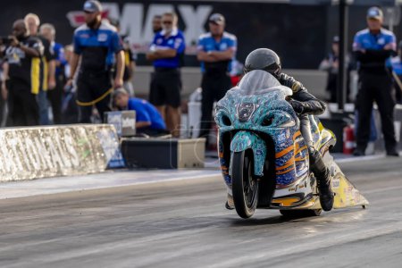 Photo for Sep 22, 2023-Concord, NC:  NHRA Pro Stock Motorcycles Series driver, Jerry Savoie, runs down the lane during a qualifying session for the Betway Carolina Nationals. - Royalty Free Image