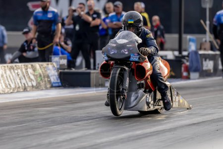 Photo for Sep 22, 2023-Concord, NC:  NHRA Pro Stock Motorcycles Series driver, Lance Bonham, runs down the lane during a qualifying session for the Betway Carolina Nationals. - Royalty Free Image