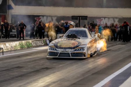 Photo for Sep 22, 2023-Concord, NC:  NHRA Funny Car Series driver, Tim Wilkerson, runs down the lane during a qualifying session for the Betway Carolina Nationals. - Royalty Free Image