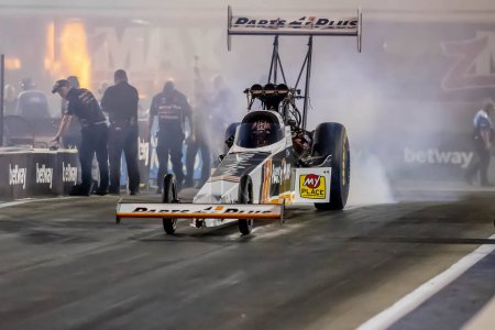Photo for Sep 22, 2023-Concord, NC:  NHRA Top Fuel Dragster Series driver, Clay Millican, runs down the lane during a qualifying session for the Betway Carolina Nationals. - Royalty Free Image